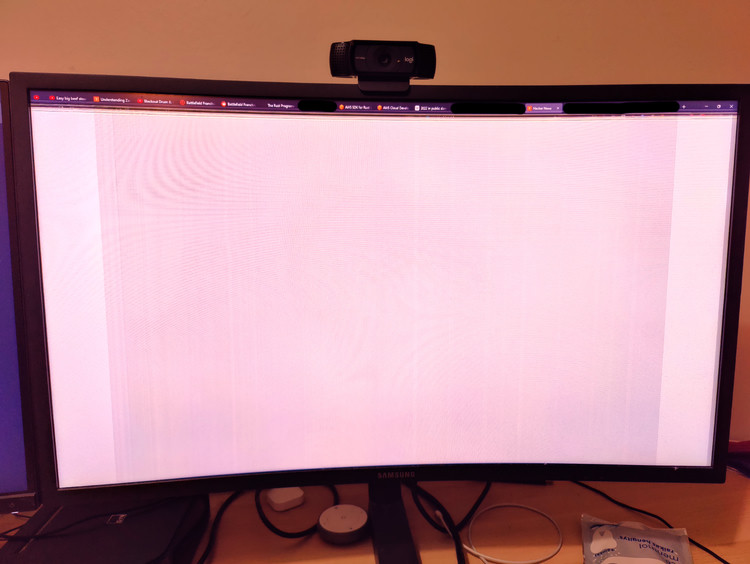 A monitor screen mostly covered in horizontal scanlines.